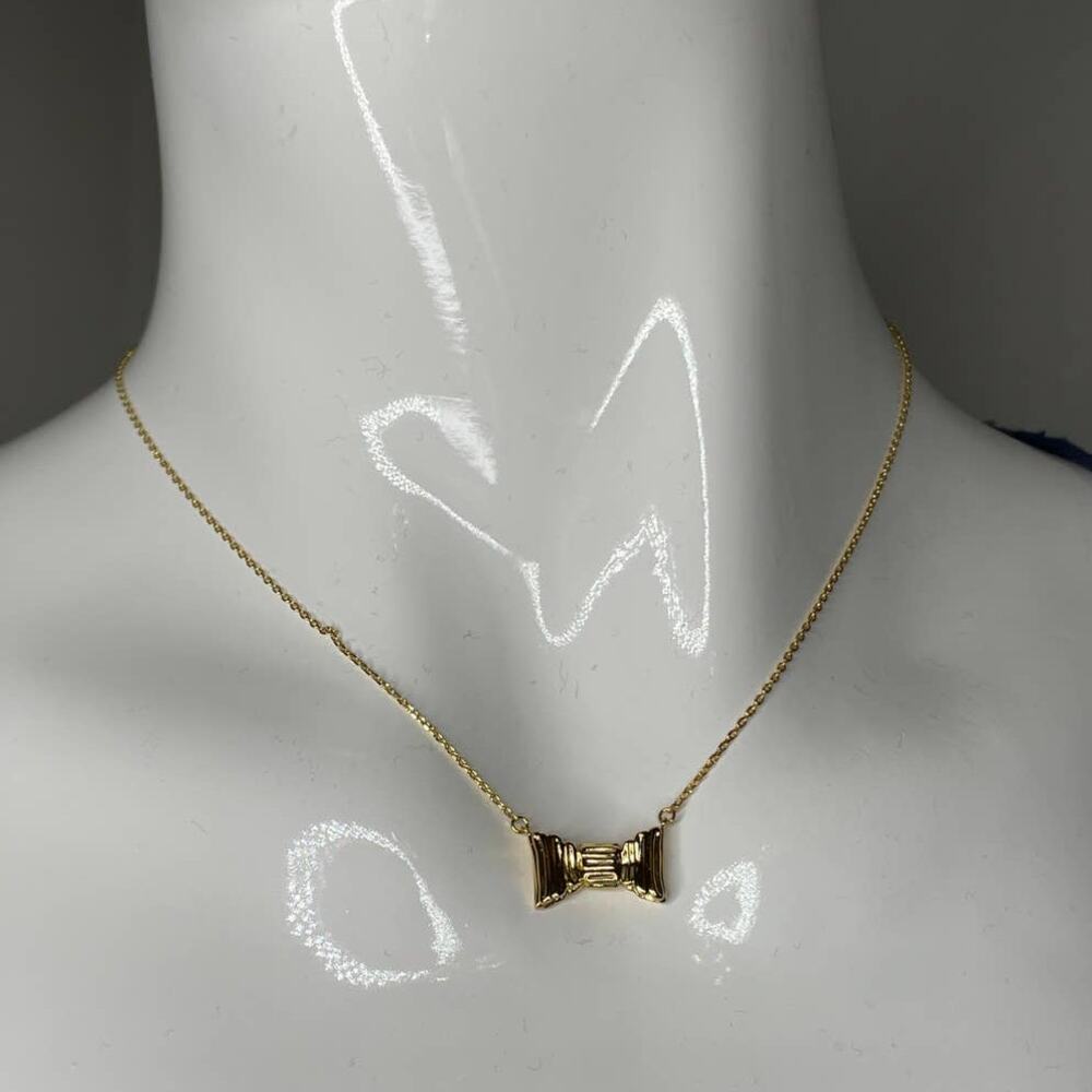 Kate Spade all wrapped up mini pendant Gold Tone Necklace
